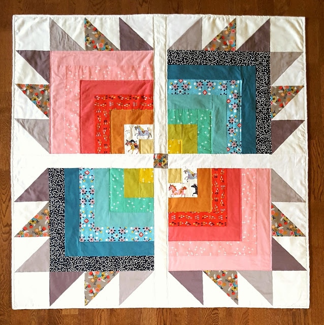 quilt blocks in various colors on white cutting mat