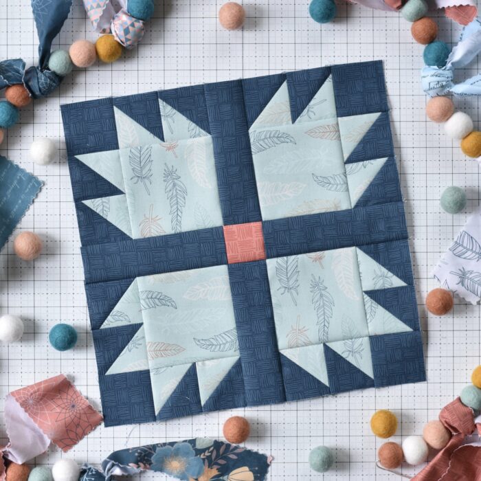 quilt blocks in various colors on white cutting mat