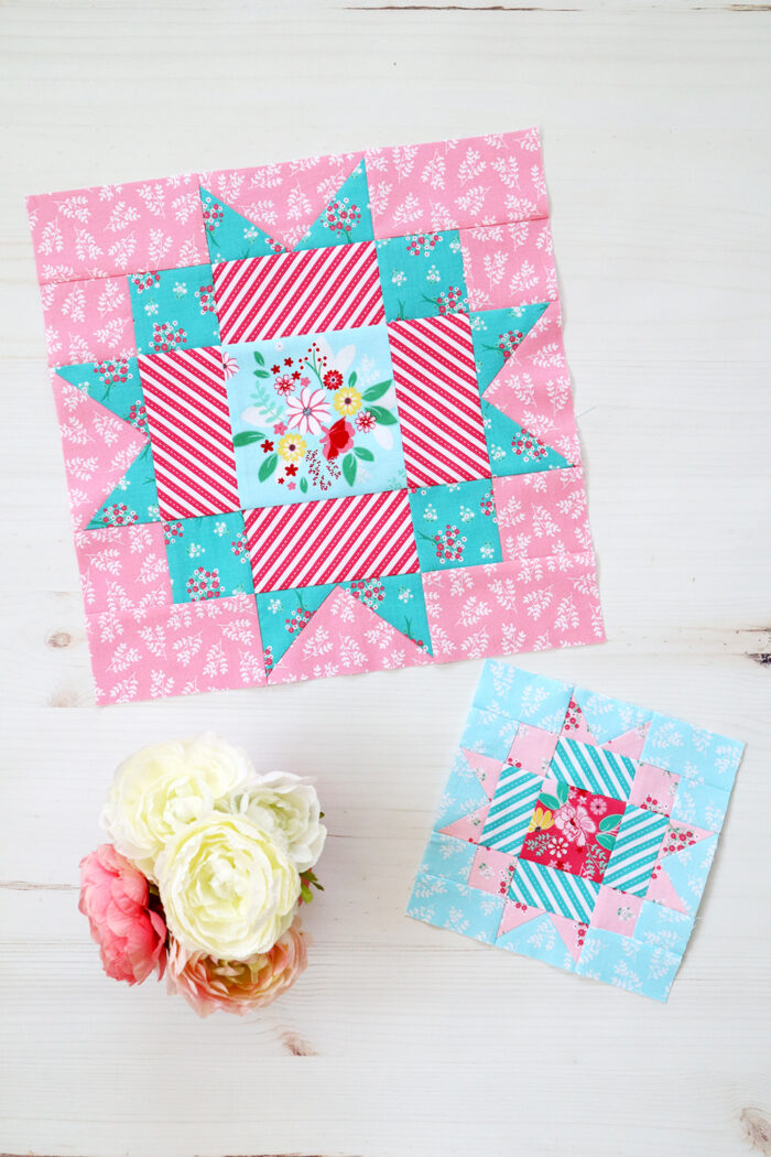 pink and blue quilt blocks on white table