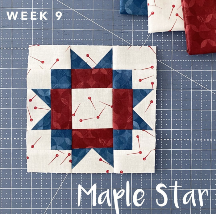 Red white and blue quilt block on blue cutting mat