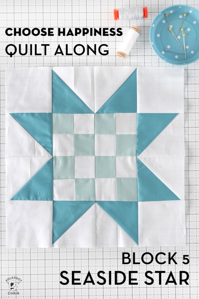 blue and white quilt block pieced on white cutting mat