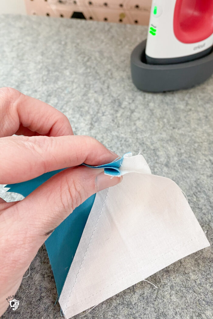 quilt blocks held in hand