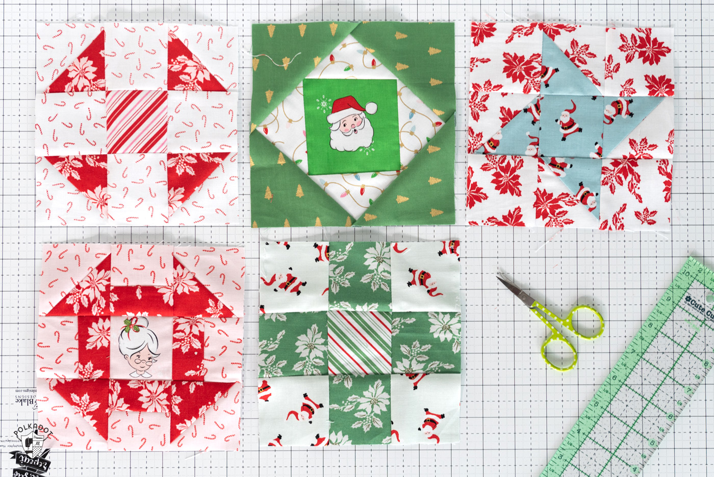 red and green quilt block patterns on white cutting mat
