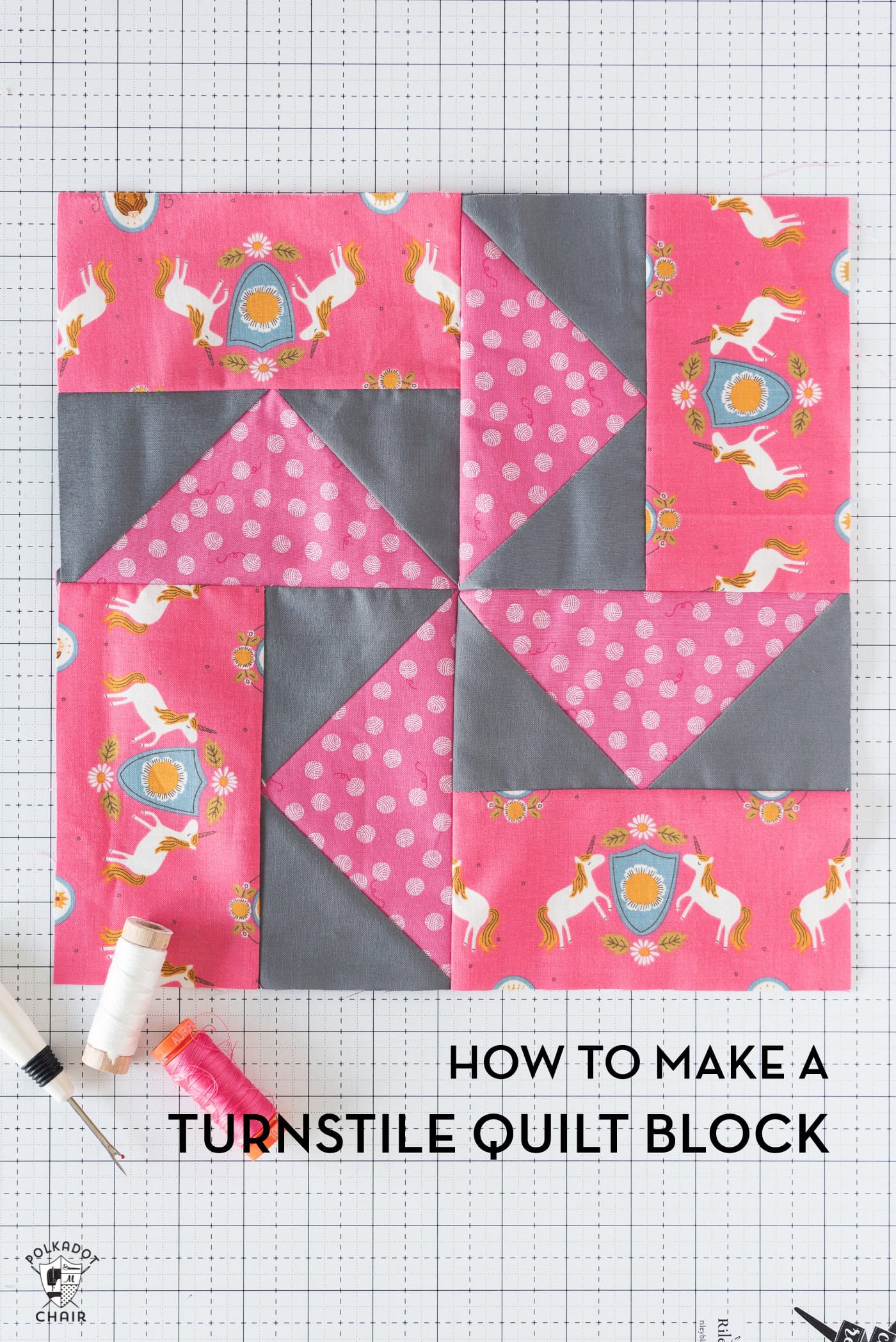 Pink and gray quilt block on white cutting mat