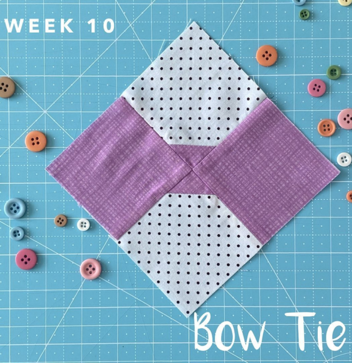 bow tie quilt block on blue cutting mat