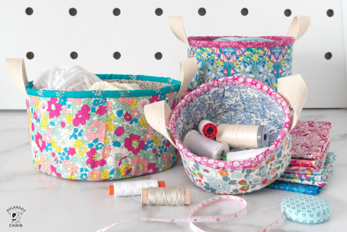 nesting fabric baskets on white marble table