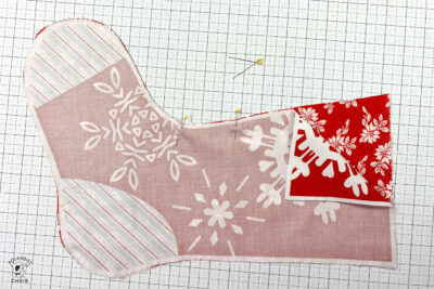 christmas stockings in progress on white cutting mat