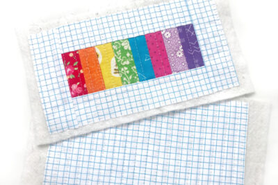 cut fabric for pencil pouch on white table
