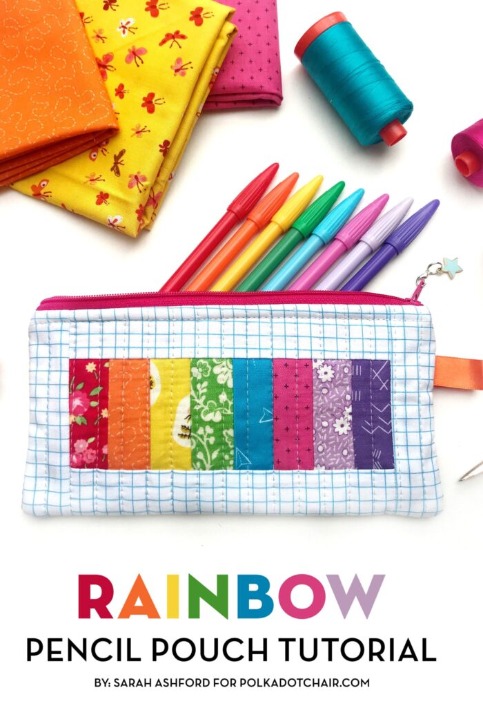 rainbow pencil pouch on white table with spools of thread and fabric