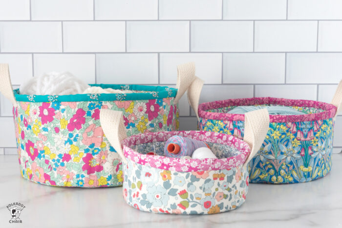 nesting fabric baskets on white marble table