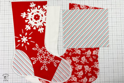 christmas stockings in progress on white cutting mat