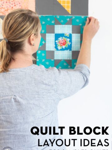 woman placing quilt block on white wall
