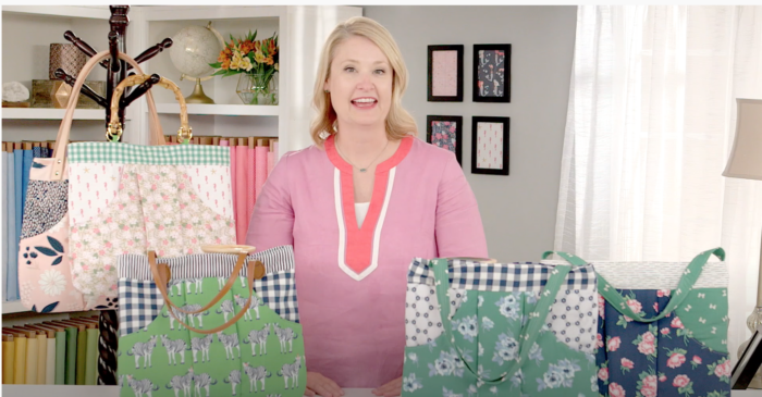 Woman on video set with handbags in forefront of photo