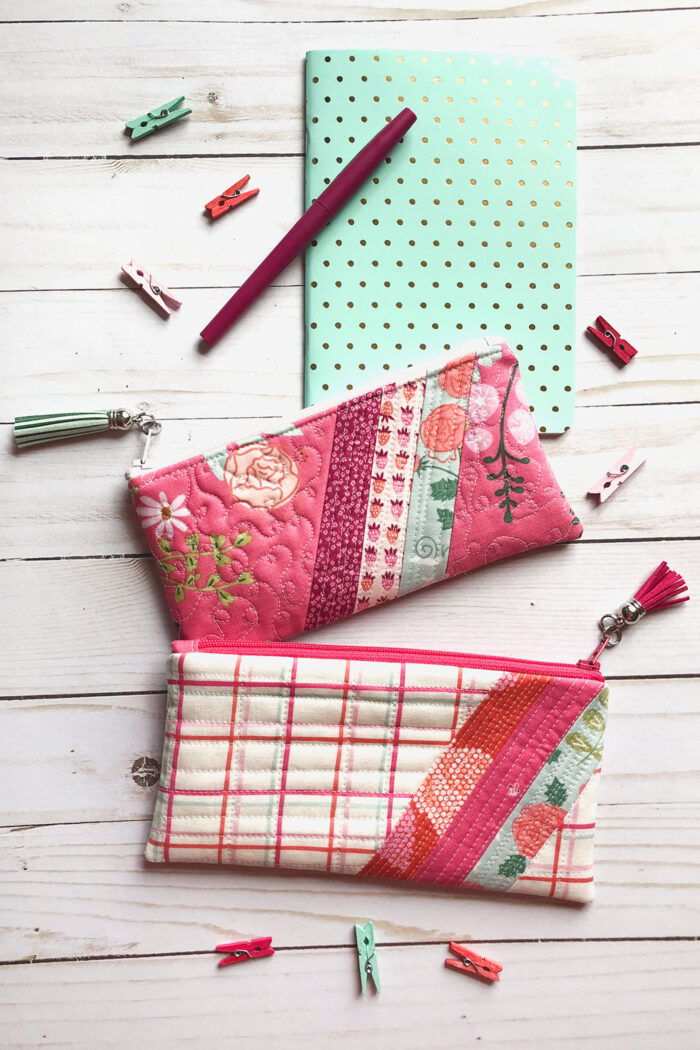 striped pencil pouch on white wood grain table with school supplies