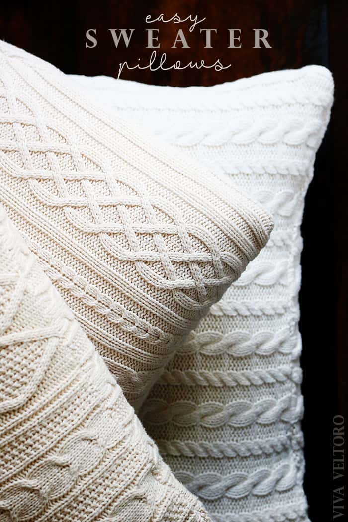 3 sweater pillows on wood floor