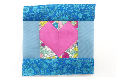 heart quilt block on white table