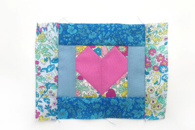 heart quilt block on white table