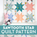 Sawtooth star quilt on white wall