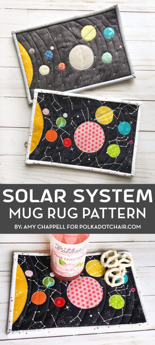 Colorful fabric Solar System mug rug on white wood table