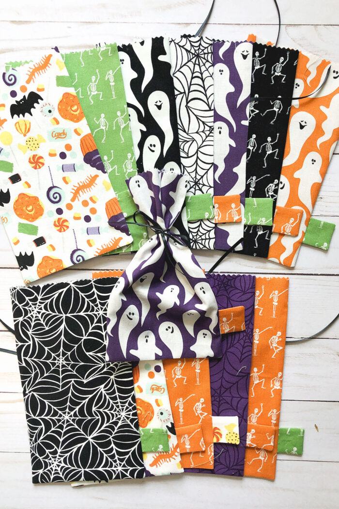 multi colored halloween treat bags on table
