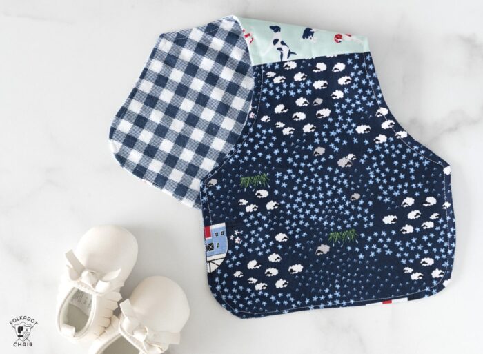 blue baby burp cloths on white marble countertop