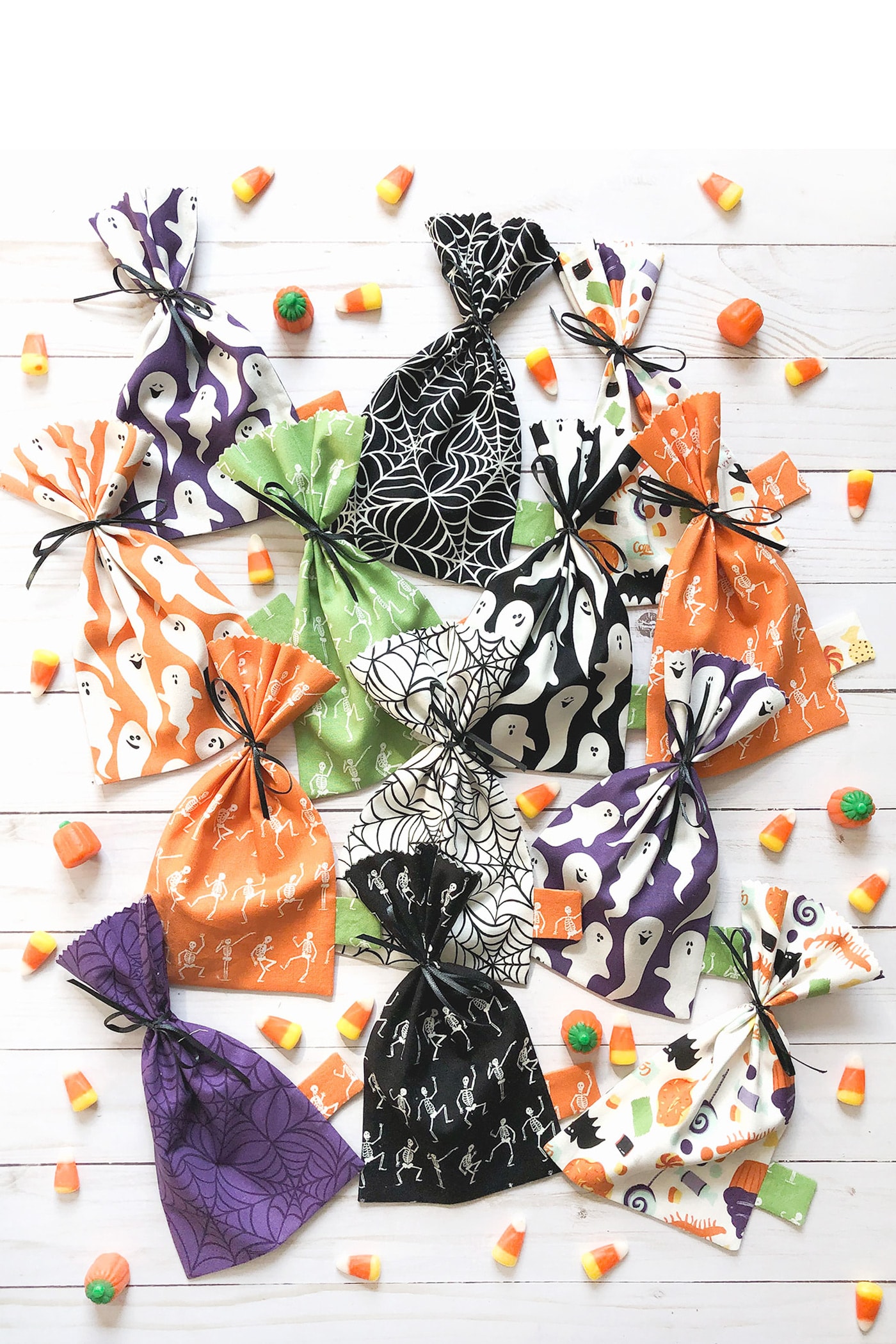 multi colored halloween treat bags on table