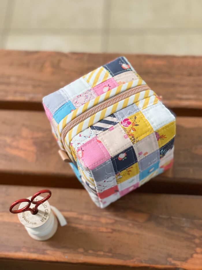 colorful patchwork box pouch on wood table