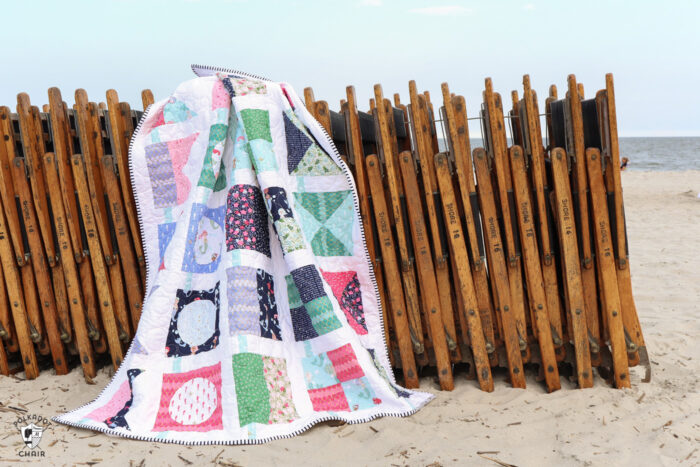 seas the day nautical quilt on wood beach chairs on beach