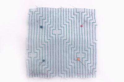 pinned square of fabric
