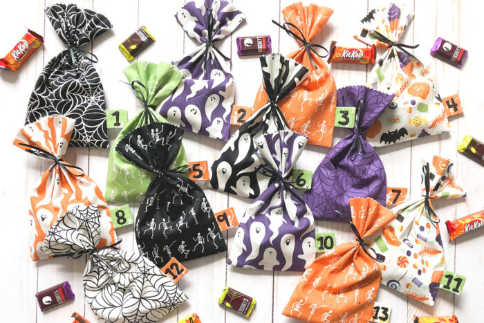 multi colored halloween treat bags on table