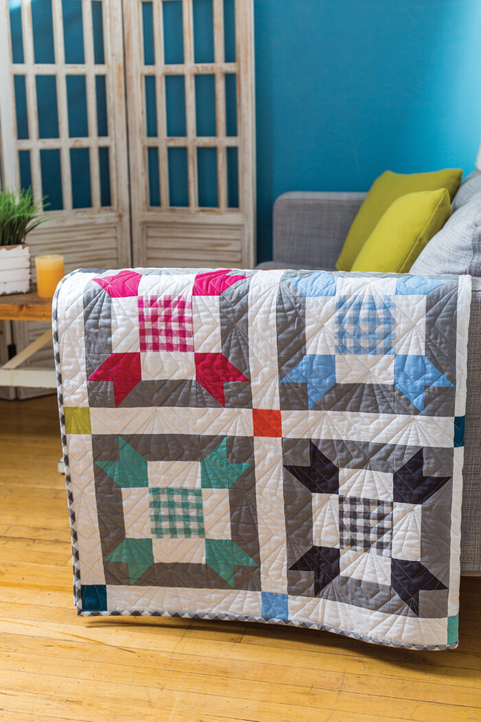 colorful quilt on arm of couch