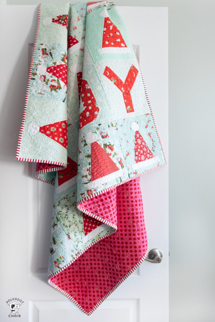 santa hat quilt hanging on door