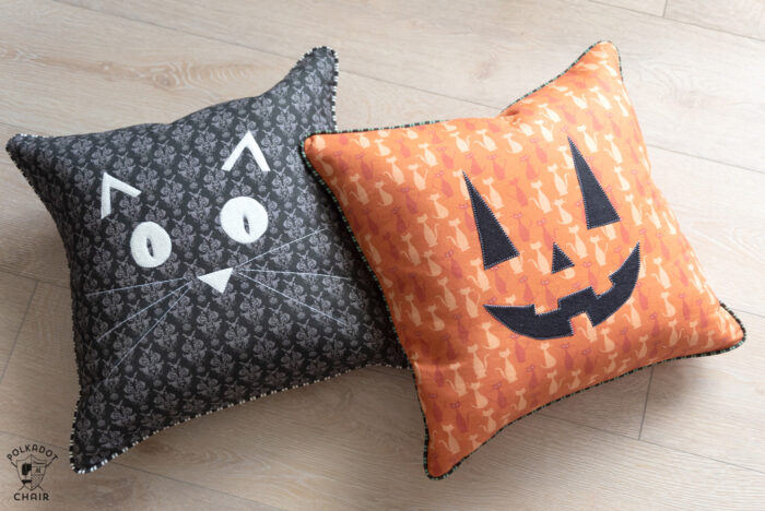 halloween pillows on wood floor