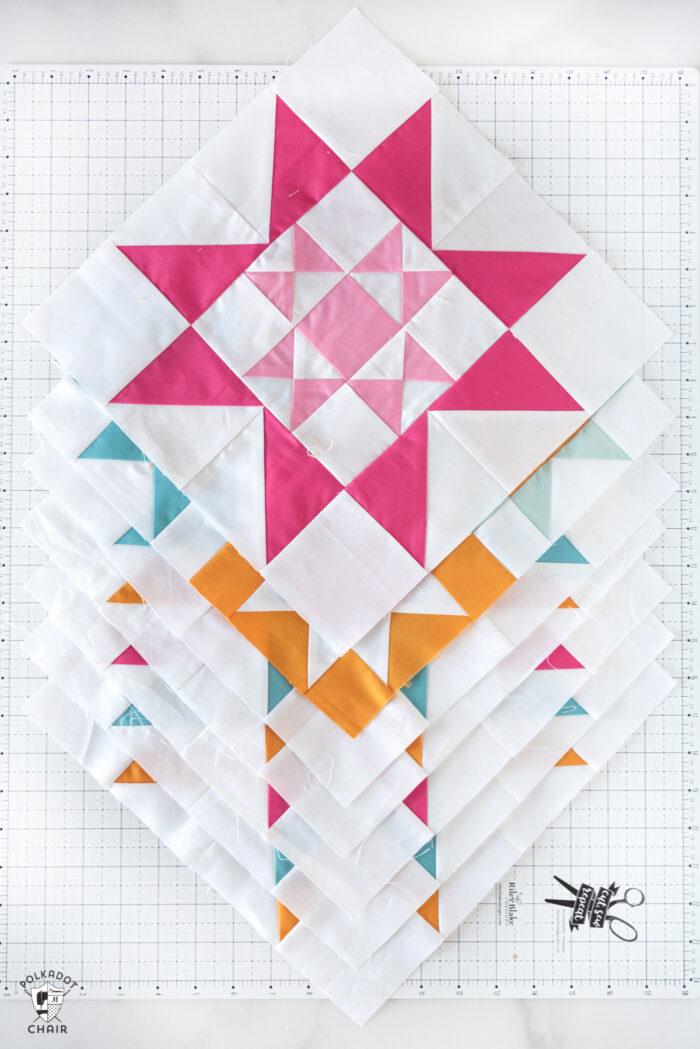 Colorful quilt block on white cutting mat