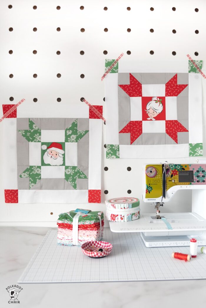 red and green christmas quilt blocks on peg board