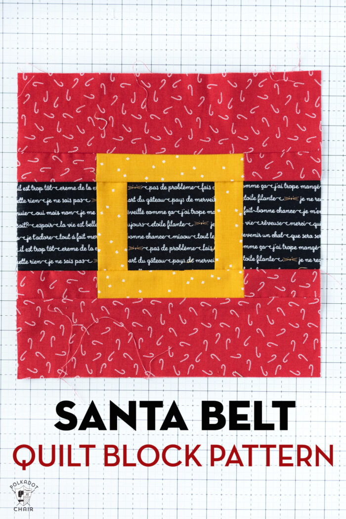 Photo of sewn santa belt quilt block on white cutting mat