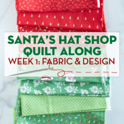 Christmas fabrics in reds and greens in stack on white marble tabletop