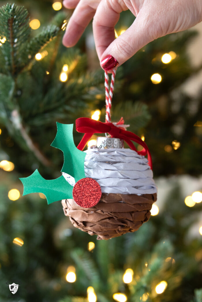 Twisted paper ornament hanging on Christmas tree