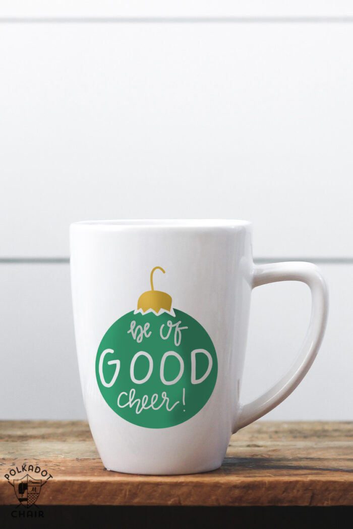 white coffee mug with green ornament