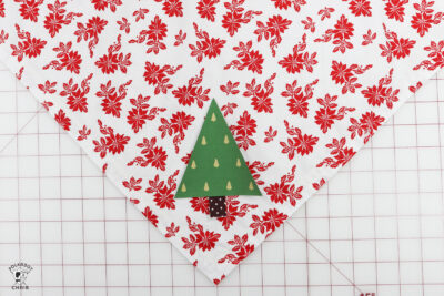 triangle christmas tree on fabric on cutting mat