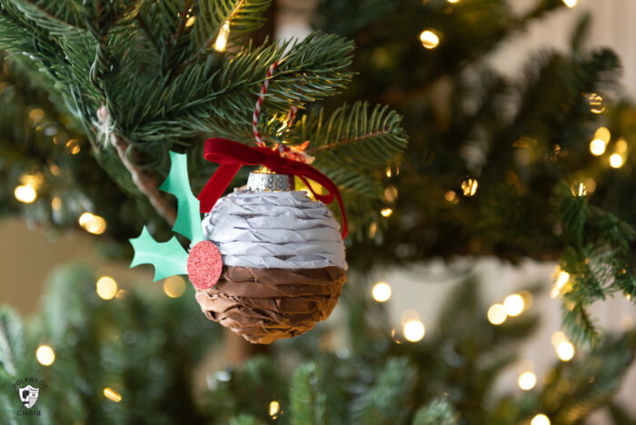 Twisted paper ornament hanging on Christmas tree