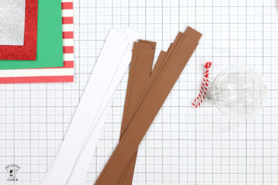 strips of paper on white cutting mat