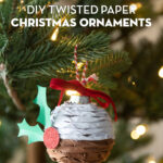 Twisted paper ornament hanging on Christmas tree