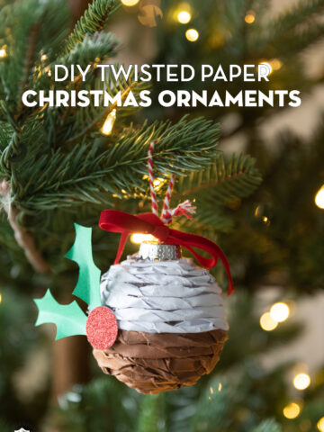 Twisted paper ornament hanging on Christmas tree