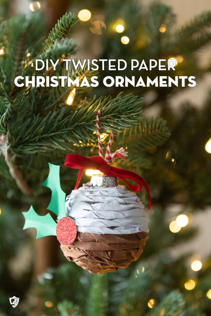 Twisted paper ornament hanging on Christmas tree