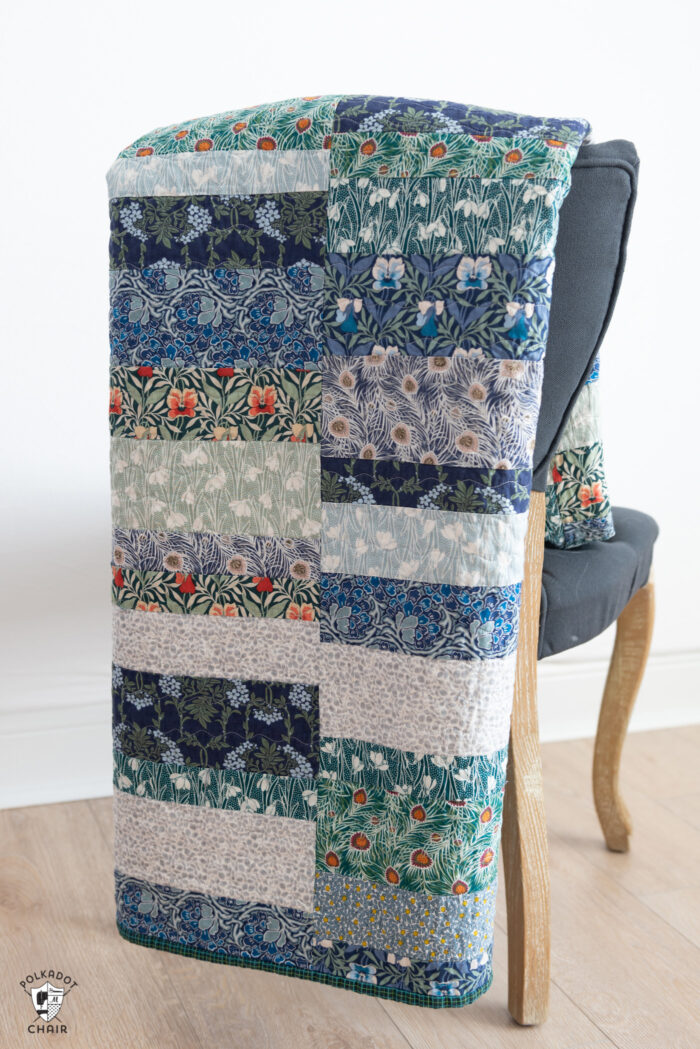 photo of a blue, green quilt on gray chair