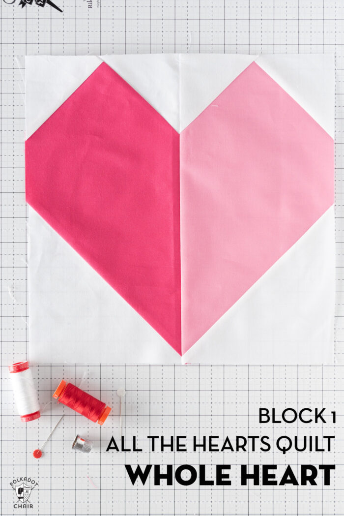 Pink and white heart quilt block on white cutting mat