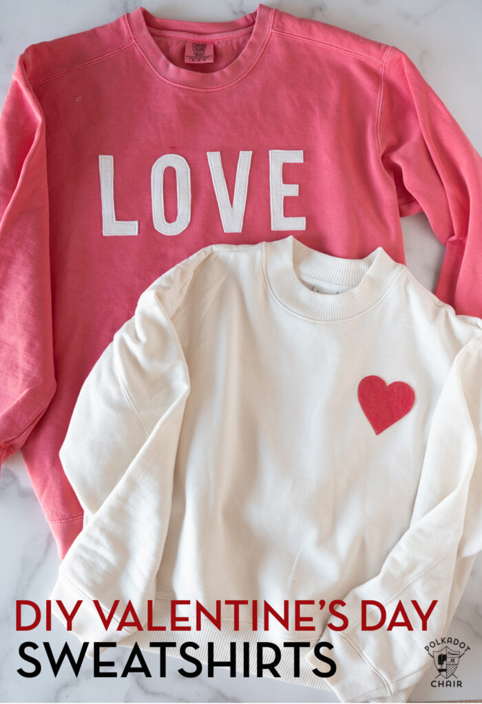 coral and ivory sweatshirts on white table