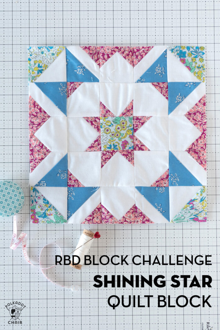 Blue, white and pink quilt block on white cutting mat