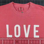 Love cut out on coral sweatshirt